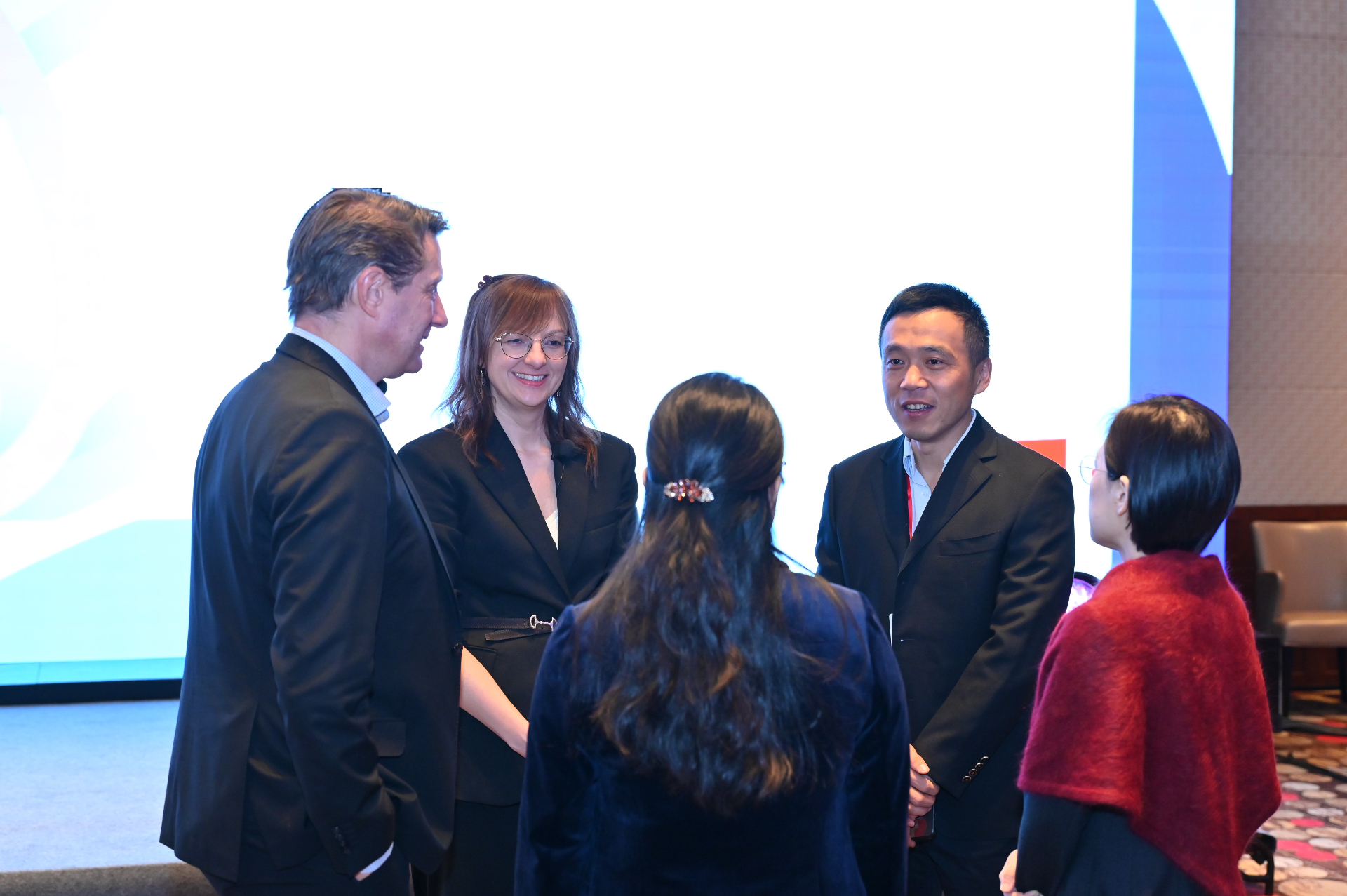 Agnieszka Turowska with Dr. Peter Szecsödy and Dr. Wei Xu at an international meeting